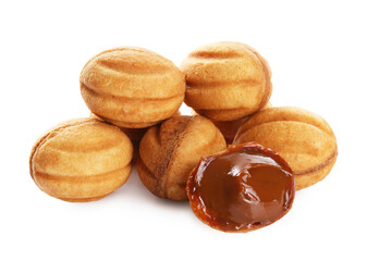 Delicious nut shaped cookies with boiled condensed milk isolated on white
