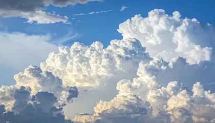 Cumulus clouds dominate the bright blue sky, puffy and white