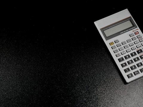 A handheld electronic vintage calculator with an LCD display and 42 keys. It was manufactured in Japan and was a popular model among students and technicians in the 1980s.
