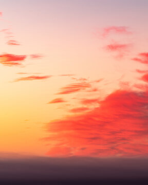 Soft Pastel Sunset Sky with Pink and Orange Clouds