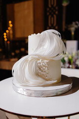 Close-up of a large white most beautiful sweet cake