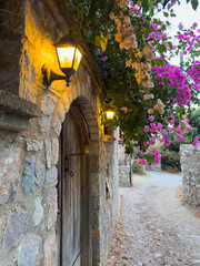 Bougainvillea Adorned Red Door of an Old Datca House , Aegean Architecture