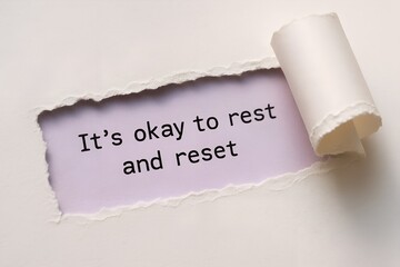 Torn Paper Quote &ldquo;It&rsquo;s Okay to Rest and Reset&rdquo; &mdash; Wellness Message on Lilac Paper Background
