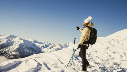 woman hiking in high Tatra mountains in winter