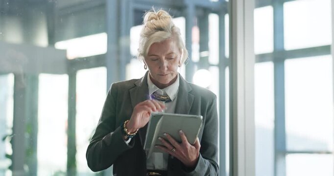 Think, reading and business woman with tablet in office for financial review, research or decision. Technology, problem solving and mature consultant planning project, insight or investment report