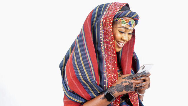 Beautiful African woman dressed in Nigerian traditional attire 