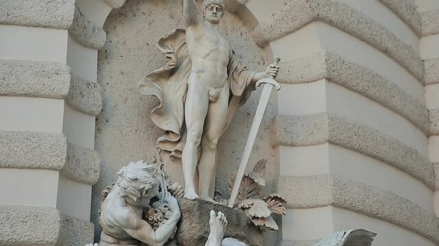 Detail of the Albrechtsbrunnen (Albrecht Fountain) in Vienna, featuring dynamic white marble sculptures of mythical figures and an eagle. A prominent landmark at the Hofburg Palace.

