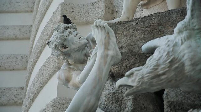 Detail of the Albrechtsbrunnen (Albrecht Fountain) in Vienna, featuring dynamic white marble sculptures of mythical figures and an eagle. A prominent landmark at the Hofburg Palace.

