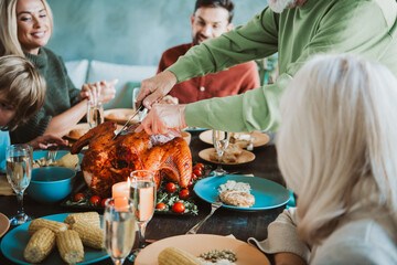Lively thanksgiving family dinner as friends and relatives share turkey and joy around a candlelit table