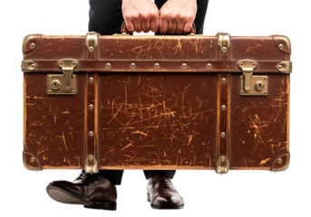 Man carrying a vintage brown suitcase with leather details isolated on transparent background, evoking travel, adventure, and timeless style