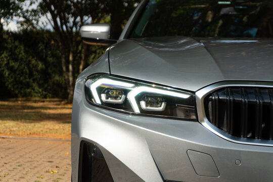 BMW 3 Series adaptive LED headlight detail, grey luxury sedan front end