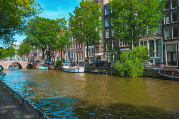 August 20, 2025, Amsterdam, Netherlands, view of the houses on the Oudezijds Voorburgwal river.