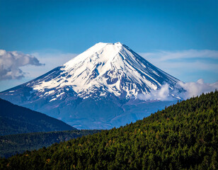 Fototapeta premium Majestic Villarrica Volcano - Snow-Capped Peak Rising Above Lush Green Forest, Chile.