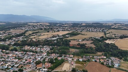 Fototapeta premium Aerial view of countryside landscape with small town and farmland