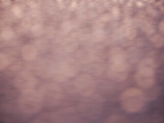 A blurry image of a purple background with a few dots scattered around. The image has a dreamy, ethereal quality to it