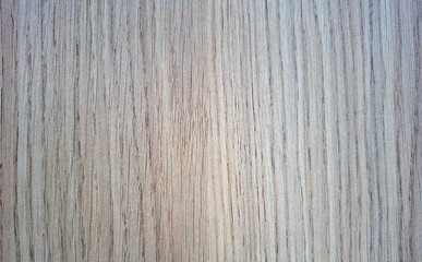 Wood laminate texture displaying natural grain patterns in light tones ideal for interior design projects or crafting