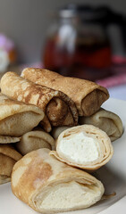 Food photography. Thin pancakes with fillings