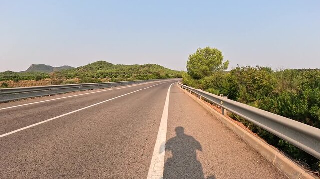 CV-320 paved road on the Palancia river in direction to Torres Torres, comarca of Camp de Morvedre, Valencia, Spain