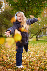 Children playing in the park during fall