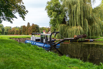 Dredging Machine in Park Pond