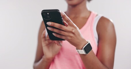 Hands, fitness and woman in studio, smartphone and connection on white background. Exercise, online chatting and person with cellphone, typing and digital app to track progress and message to contact - Powered by Adobe