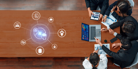 A dynamic team collaborates in a modern office environment, engaging with digital tools to strategize and visualize complex business data and technology insights. Trope