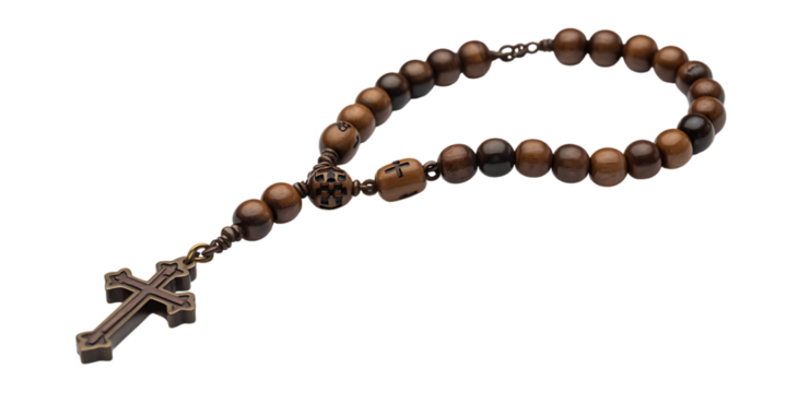 A wooden rosary with a cross pendant rests against a white background.