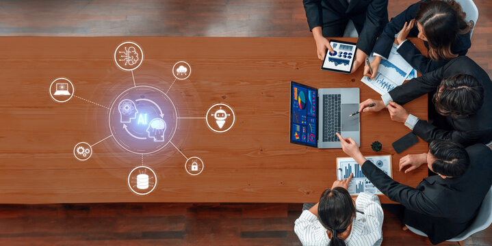 A dynamic team collaborates in a modern office environment, engaging with digital tools to strategize and visualize complex business data and technology insights. Trope