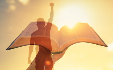 Strength in religious belief. Hand holding Bible, Man with fist up overcoming hardship life...