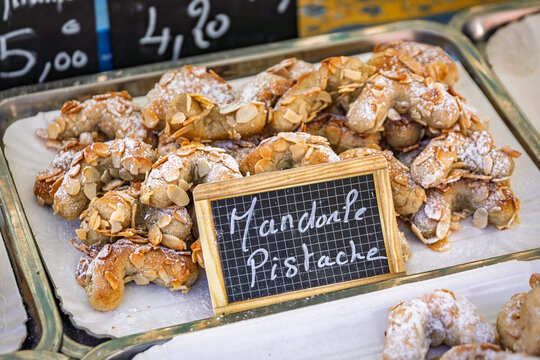 Biscotti amaretti alle mandorle e pistacchio, traditional Italian almond and pistachio cookies at the Cours Saleya market in the Old Town Nice, France