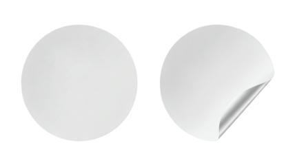 Blank white circular stickers ready for your custom design, one peeled revealing a metallic sheen, perfect for branding and labels