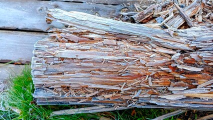 Wooden logs in the yard of a country house in winter.