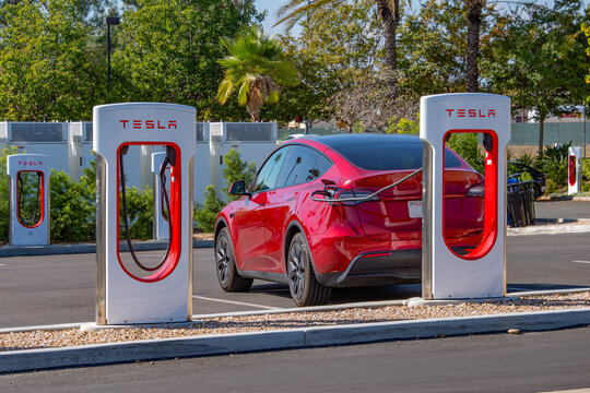 Tesla Automobile at Tesla Supercharger charging station.