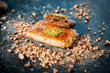 Traditional Palestinian Kulaj Sweet with Cheese  or Walnut Filling and Pistachio Garnish 
