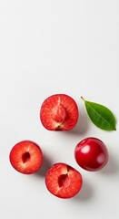 Fresh Kersen Fruit with Slices and Peel on a White Background