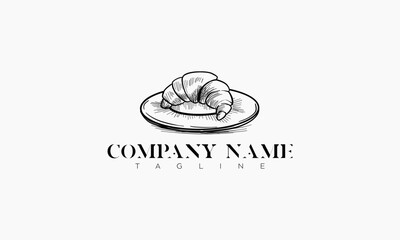 Hand-Drawn Sketch of a Croissant on a Plate