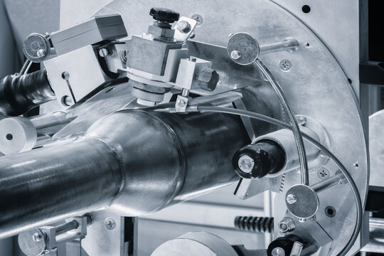 Modern automatic welding machine for welding metal pipes, industrial welding concept background