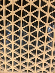 Close-up view of a geometric pattern composed of interconnected triangles.