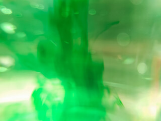 abstract background close-up of liquid droplets in water spreading