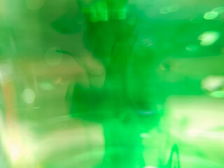 abstract background close-up of liquid droplets in water spreading