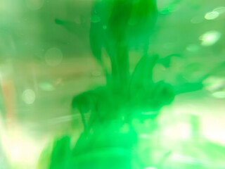 abstract background close-up of liquid droplets in water spreading