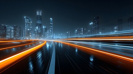 Streaks of brilliant orange and white light race across a dark, wet urban highway beside tall illuminated structures