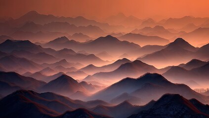 Hazy mountain range glows with warm sunrise hues, creating layered silhouettes.