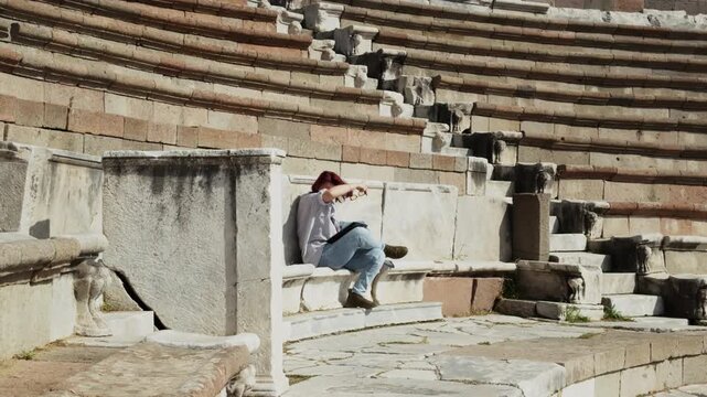 Archeology Student Working with a Tablet in the Ancient Rome Hospital Asclepieion of Pergamon
