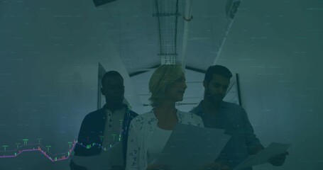 Team walking down office hallway holding reports causing transparent finance graphs spotting spike