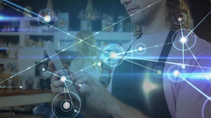 Barista tapping tablet screen at cafe counter, creating growing network map for data visualization - Powered by Adobe