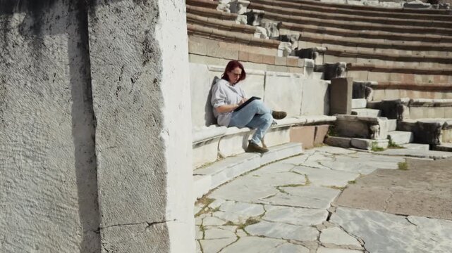 Archeology Student Working with a Tablet in the Ancient Rome Hospital Asclepieion of Pergamon