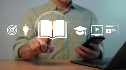 Digital Education and Online Learning Concept Man Interacting with Educational Icons on Screen Using Smartphone and Laptop for Study