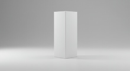 Plain white rectangular prism stands upright on a light surface against a gradient background