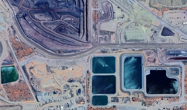 Olympic Dam Mine, Australia: High-Resolution Aerial View of Industrial Complex and Colored Tailings Dams in the Outback